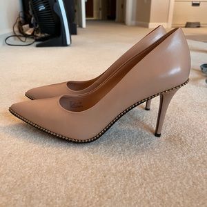 Coach nude heels with stud detail.